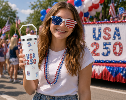 Woman wearing patriotic sunglasses and holding a 'USA 250' tumbler at a parade.