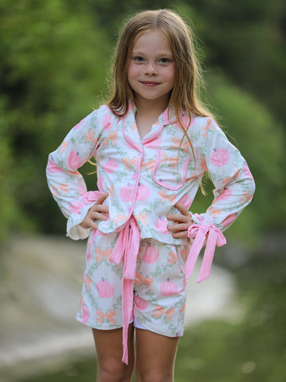 Mommy and Me Pajamas | Pumpkin Floral Shorts: Child modeling pink-trimmed set