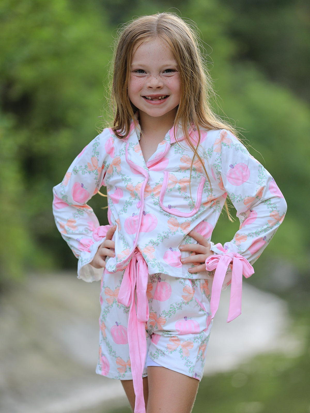 Mommy and Me Pajamas | Pumpkin Floral Shorts: Child posing in pumpkin shorts set