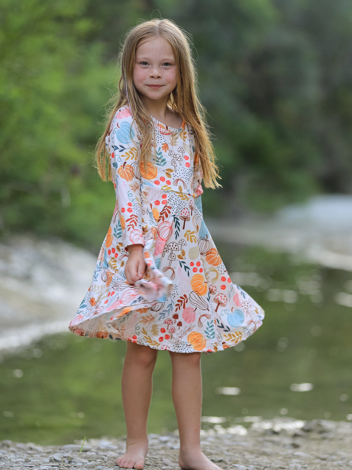 Girls Fall Dress | Pumpkin & Leaf Print: Model showing front fit