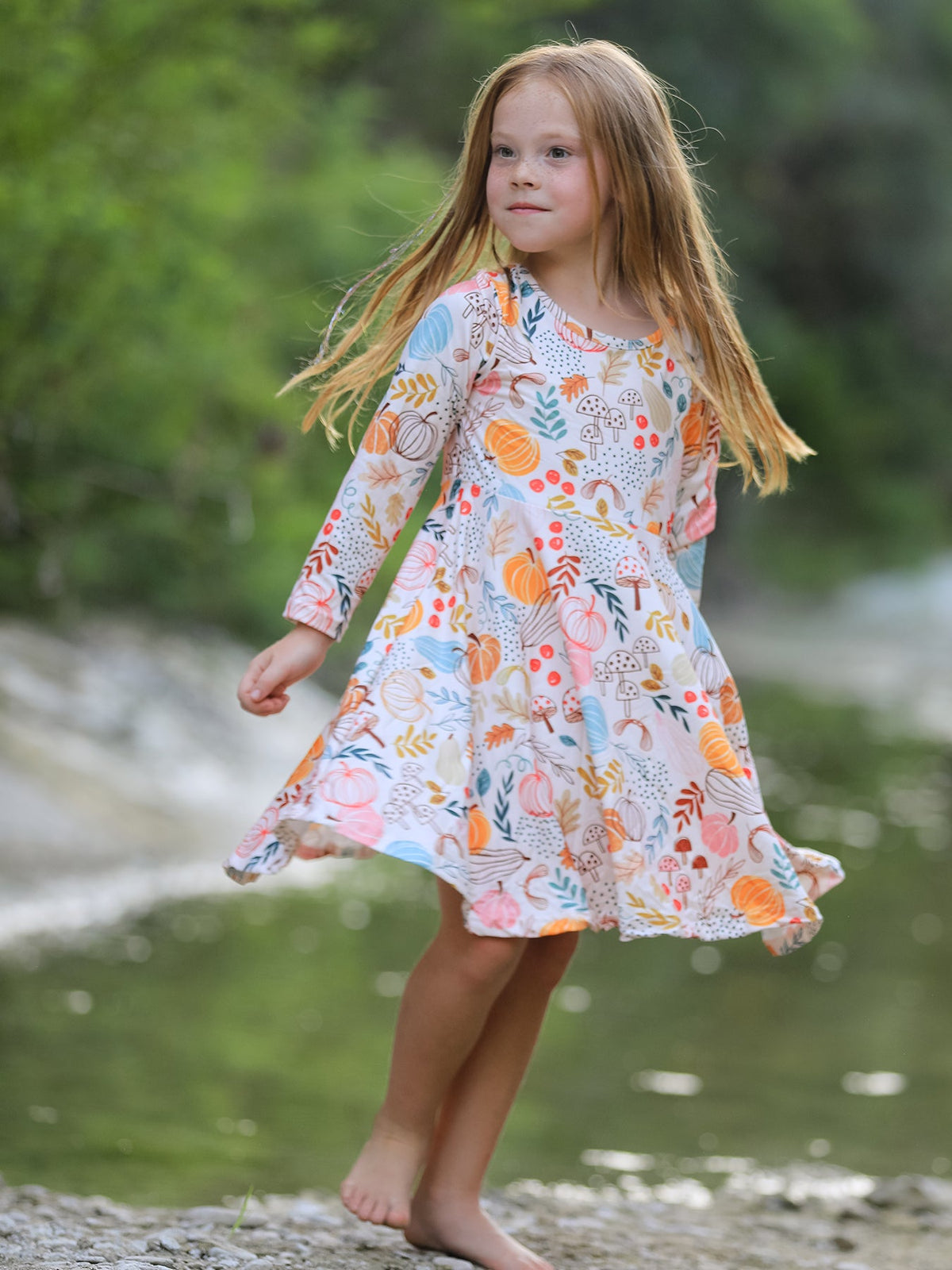 Girls Fall Dress | Pumpkin & Leaf Print: Model walking in dress