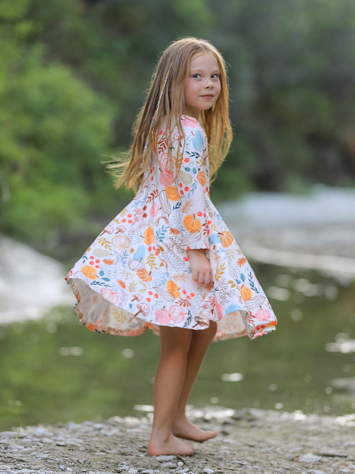 Girls Fall Dress | Pumpkin & Leaf Print: Side view while twirling