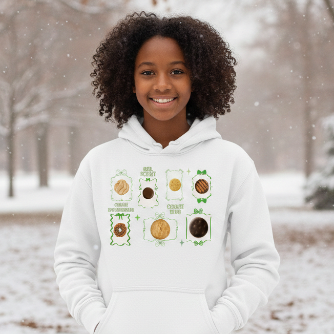 Person wearing a white hoodie with a graphic design in a snowy outdoor setting