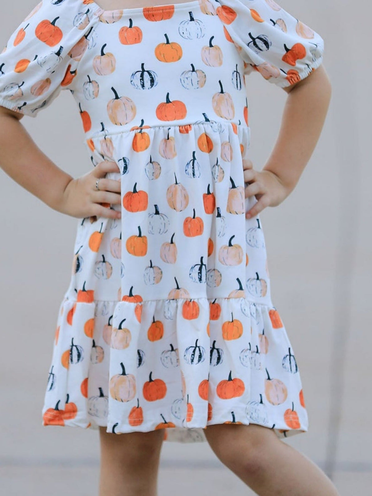 Girls Fall Dress | Pumpkin Puff Sleeves: Square neckline and gathered waist on model