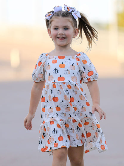 Girls Fall Dress | Pumpkin Puff Sleeves: Model showing puff sleeves and front fit