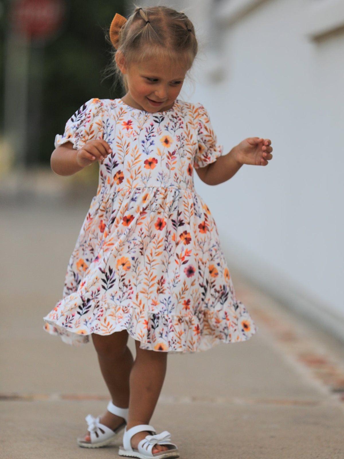 Girls Fall Dress | Floral Puff Sleeve Ruffle: Model moving in tiered skirt