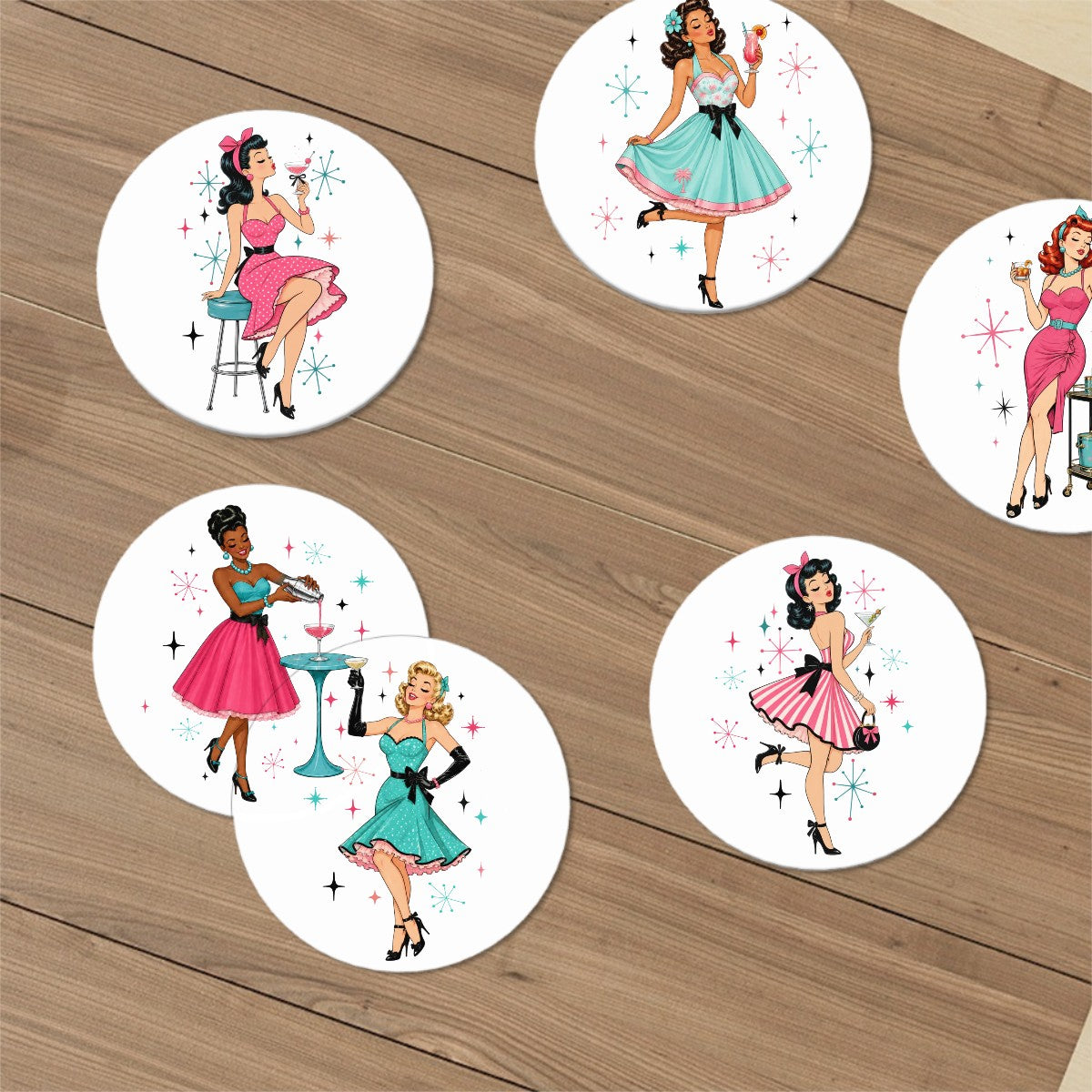 Six round white coasters with retro 1950s pin-up woman illustrations, arranged on a brown wooden tabletop.