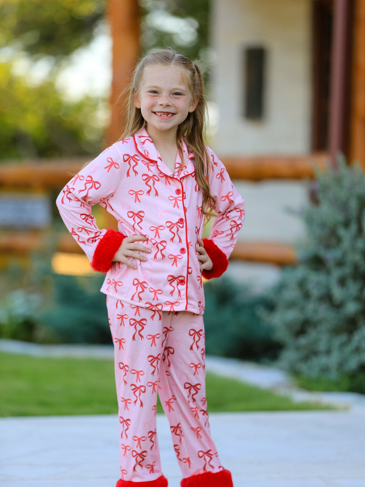 Girls Christmas Pajamas | Pink Bow Furry Trim: Model wearing top and full-length pants