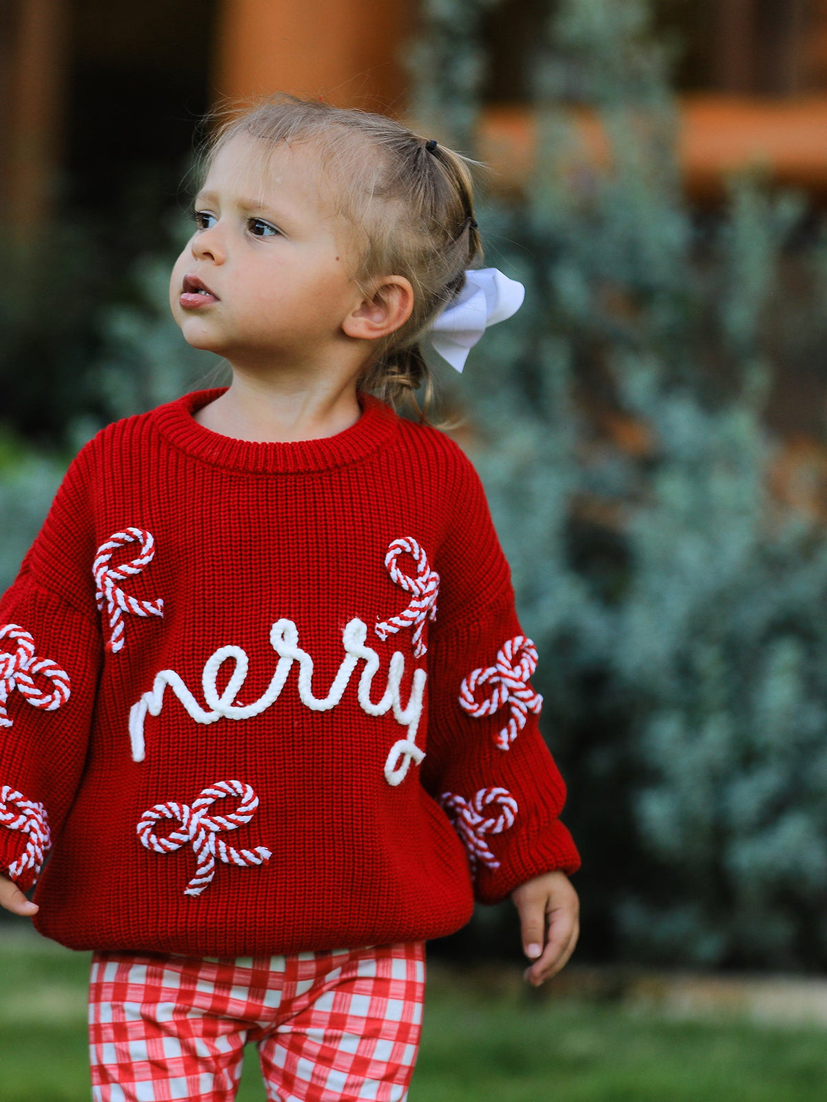 Mommy and Me Sweaters | Red Merry & Bows: Toddler showing sleeve and bow details