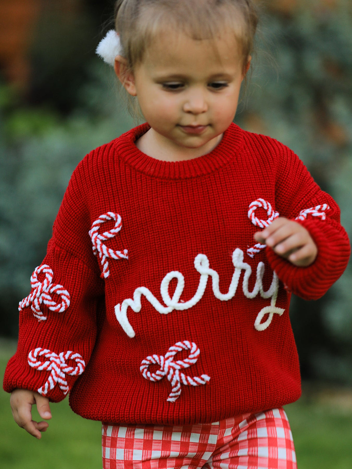 Mommy and Me Sweaters | Red Merry & Bows: Toddler wearing red merry pullover